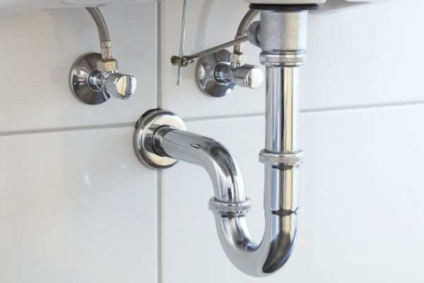 P-trap pipes under a kitchen sink