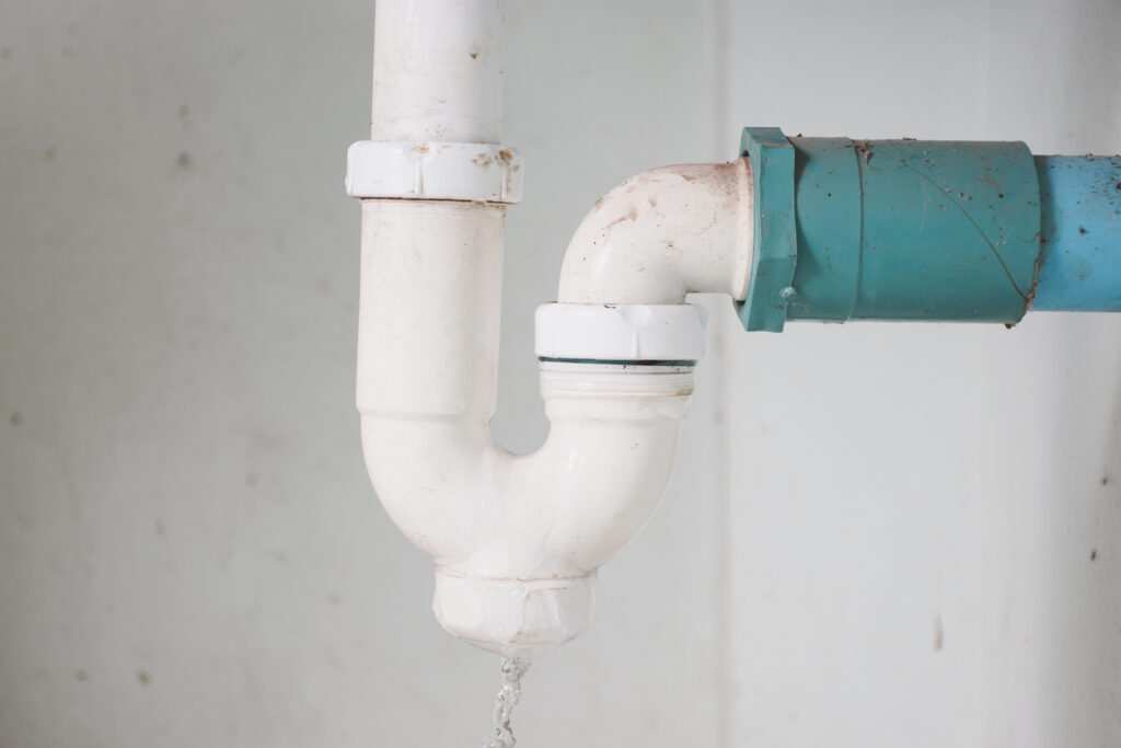 Under-sink trap and drain pipes close-up